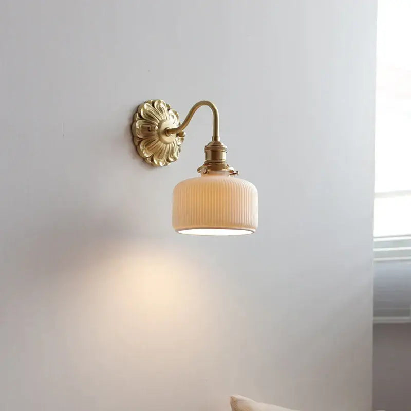 Antique brass ribbed ceramic led wall light with fluted cream glass shade ideal for bedroom wall lights decorbites ceramic led