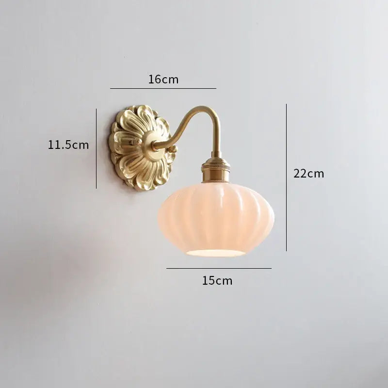 Antique brass wall lights with ornate floral backplate and peach ribbed ceramic led glass shade for bedroom decorbites ceramic led wall