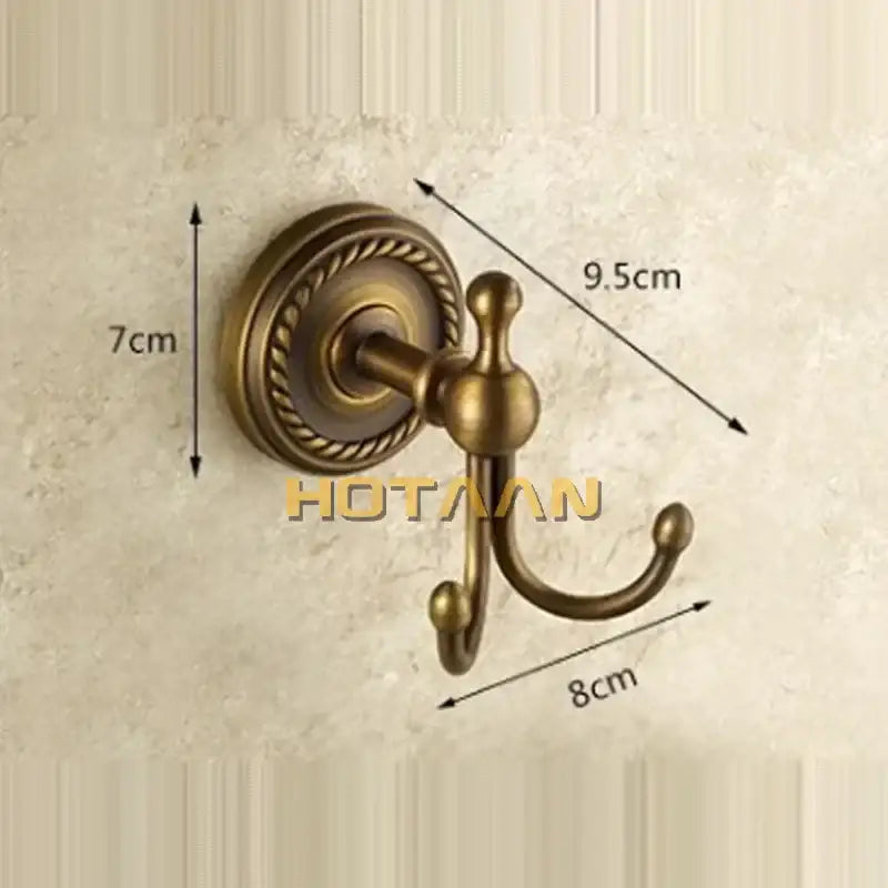 Antique brass rope wall hooks with ornate detailing on circular base double coat hanger for bathroom use brass wall hooks