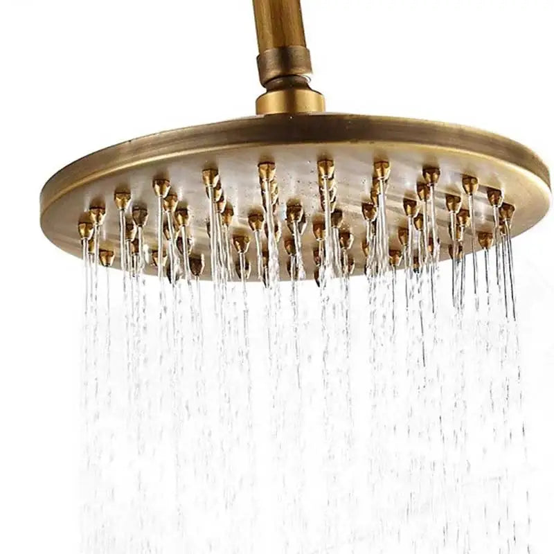 Brass-finished antique brass round shower faucet set with multiple water jets and handheld sprayer for bathroom use