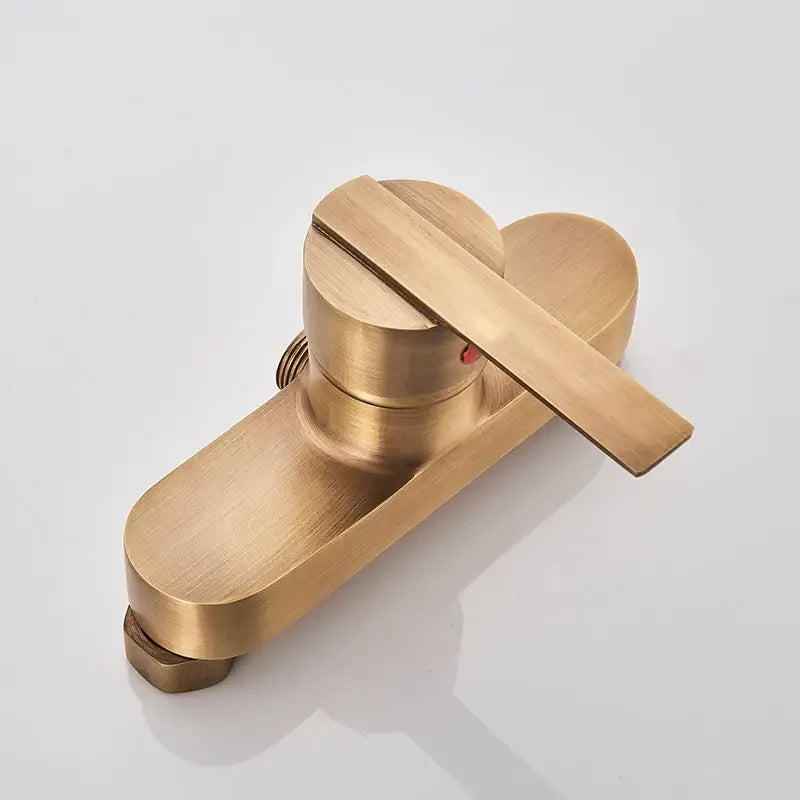 Antique brass shower faucet with handshower featuring a brass-finished modern single handle design