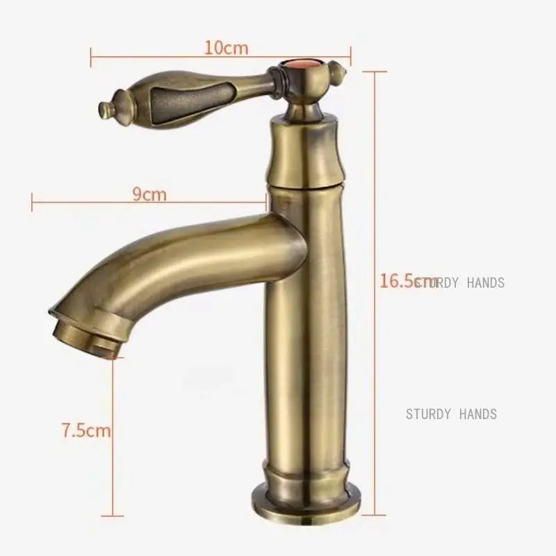 Antique brass single-handle bathroom faucet with curved spout and ornate handle design for sink fixture