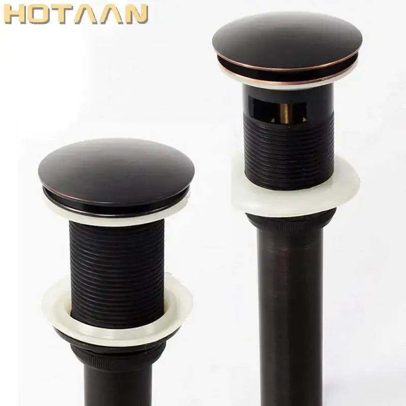Black and copper-finished decorbites brass pop sink drain stoppers with ribbed cylindrical bodies for bathroom waste