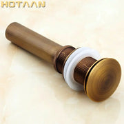 Antique brass sink drain with white rubber seal and threaded metal fittings for bathroom waste by decorbites brass pop