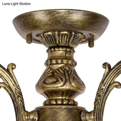 Antique brass-finished DecorBites™ Tiffany style chandelier with ornate scrollwork and blue stained glass bell shades