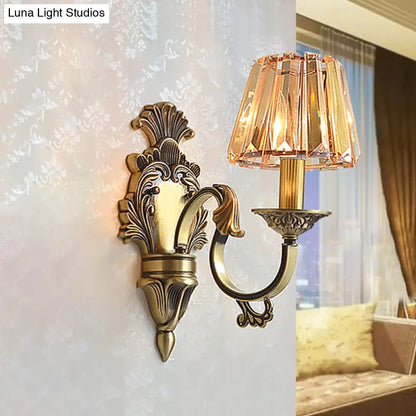 Antique brass wavy arm bedroom wall sconce with faceted amber crystal shade compatible with e12 e14 bulbs
