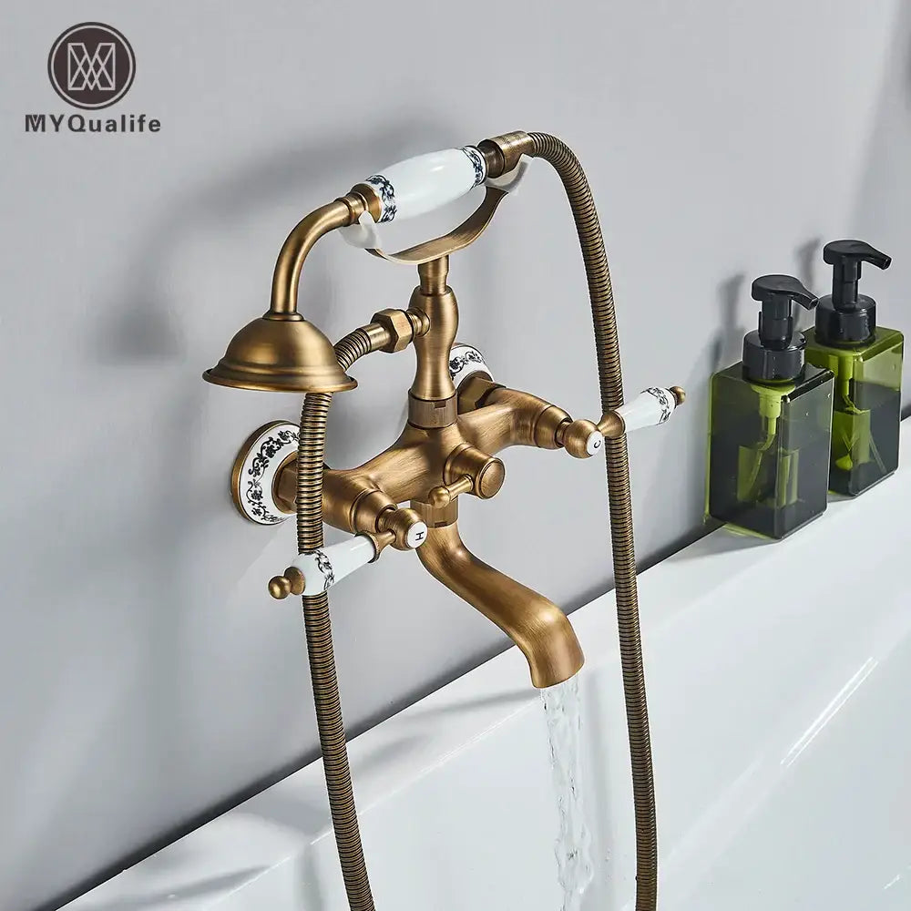Antique brass and white dual handle bathtub faucet with ceramic handles and black floral decorbites dual handle design