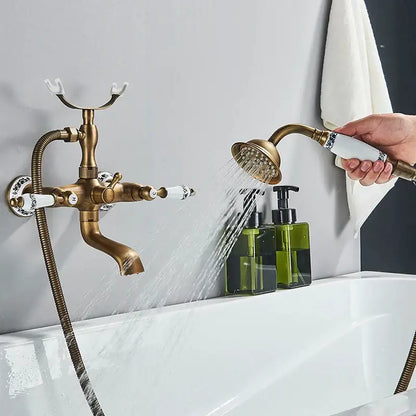 Antique brass bathtub faucet with white ceramic dual handles and ornate detailing for bathroom shower decorbites dual handle