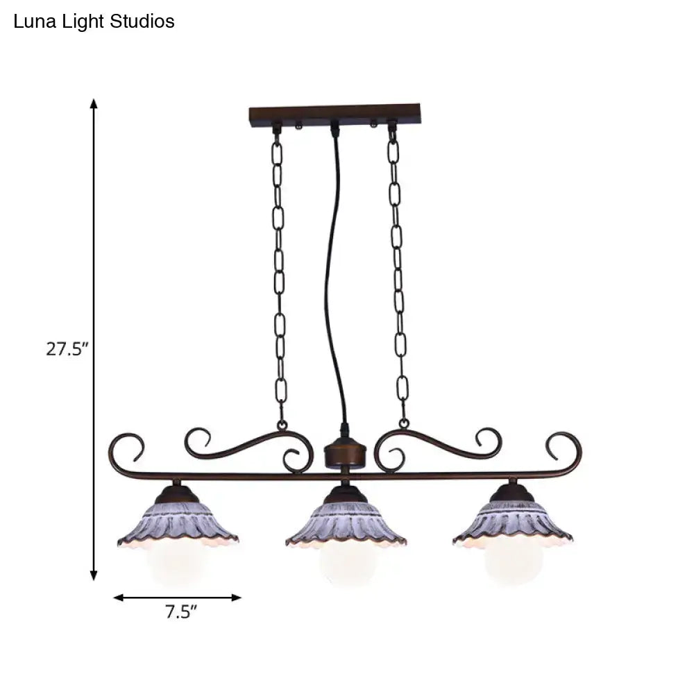 Antique bronze wrought iron island pendant lamp with three frosted glass shades and ruffled edges by decorbites