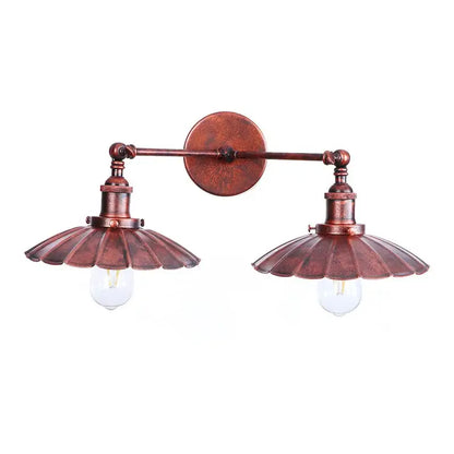 Copper-toned antique bronze adjustable rustic led wall lamp with two fluted scalloped shades and exposed bulb sockets