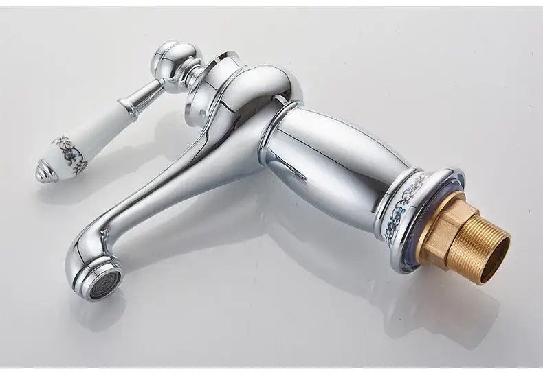DecorBites antique bronze single handle bathroom faucet with chrome finish white ceramic floral handle and brass base real shot details