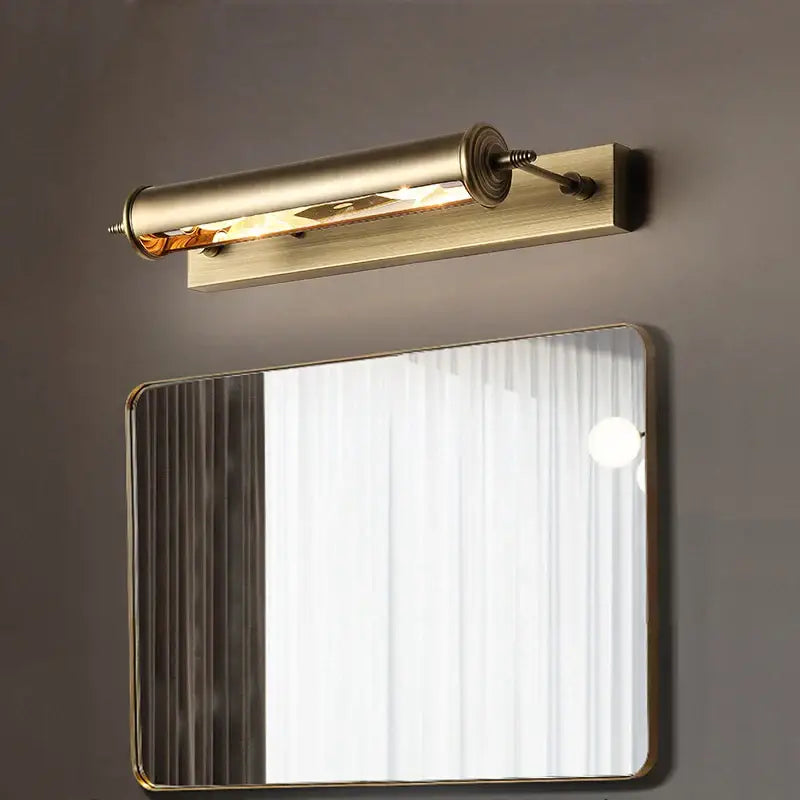 Antique bronze bathroom wall lamp with brass finish and glass vanity light featuring exposed filament bulb