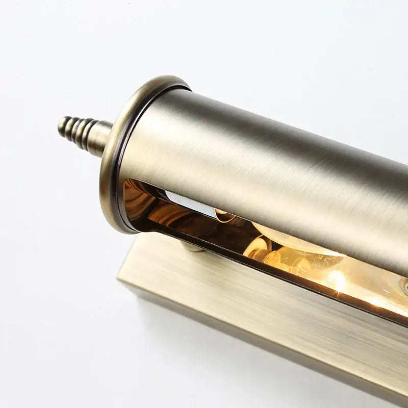Antique bronze bathroom wall lamp with brushed brass cylindrical sconce and warm-toned bulb for decorbites bronze bathroom decor