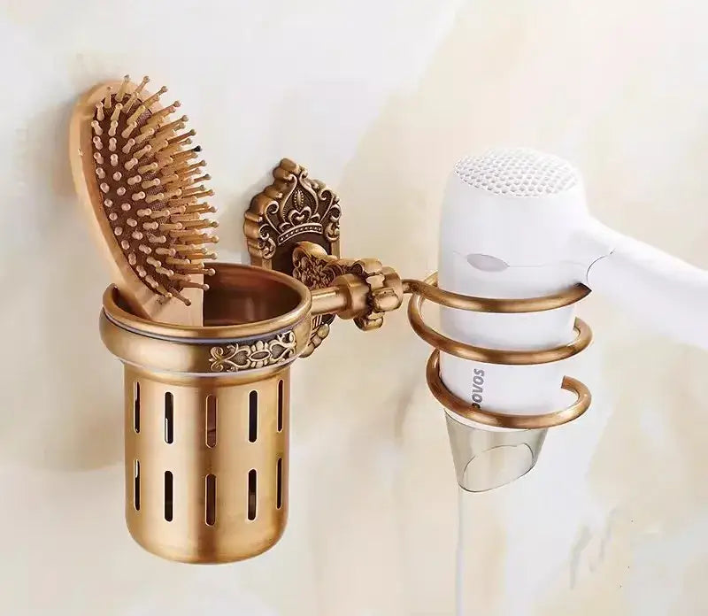 Antique brass wall-mounted hairbrush and hairdryer organizer with ornate detailing from decorbites bronze carved bath set