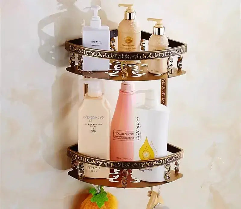 Brass-colored ornate two-tiered bathroom wall rack with decorative scrollwork edges in decorbites bronze carved bath accessories set
