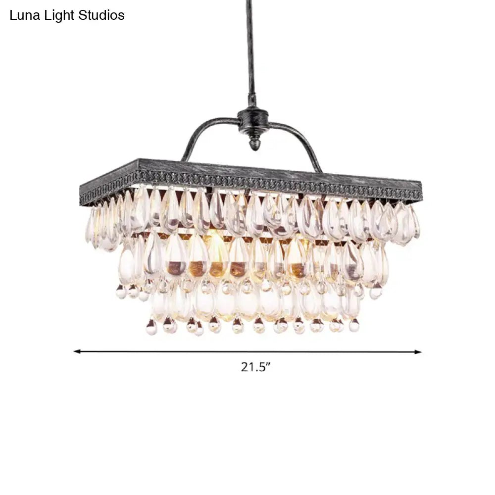 Antique bronze rectangular chandelier with multiple tiers of clear crystal teardrop accents for dining room lighting