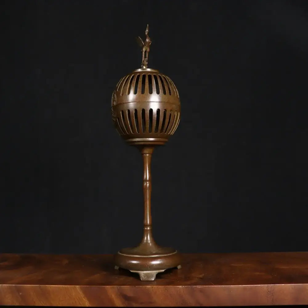 Antique bronze crane incense burner with vertical slits and small figurine dome for living room decorbites decor