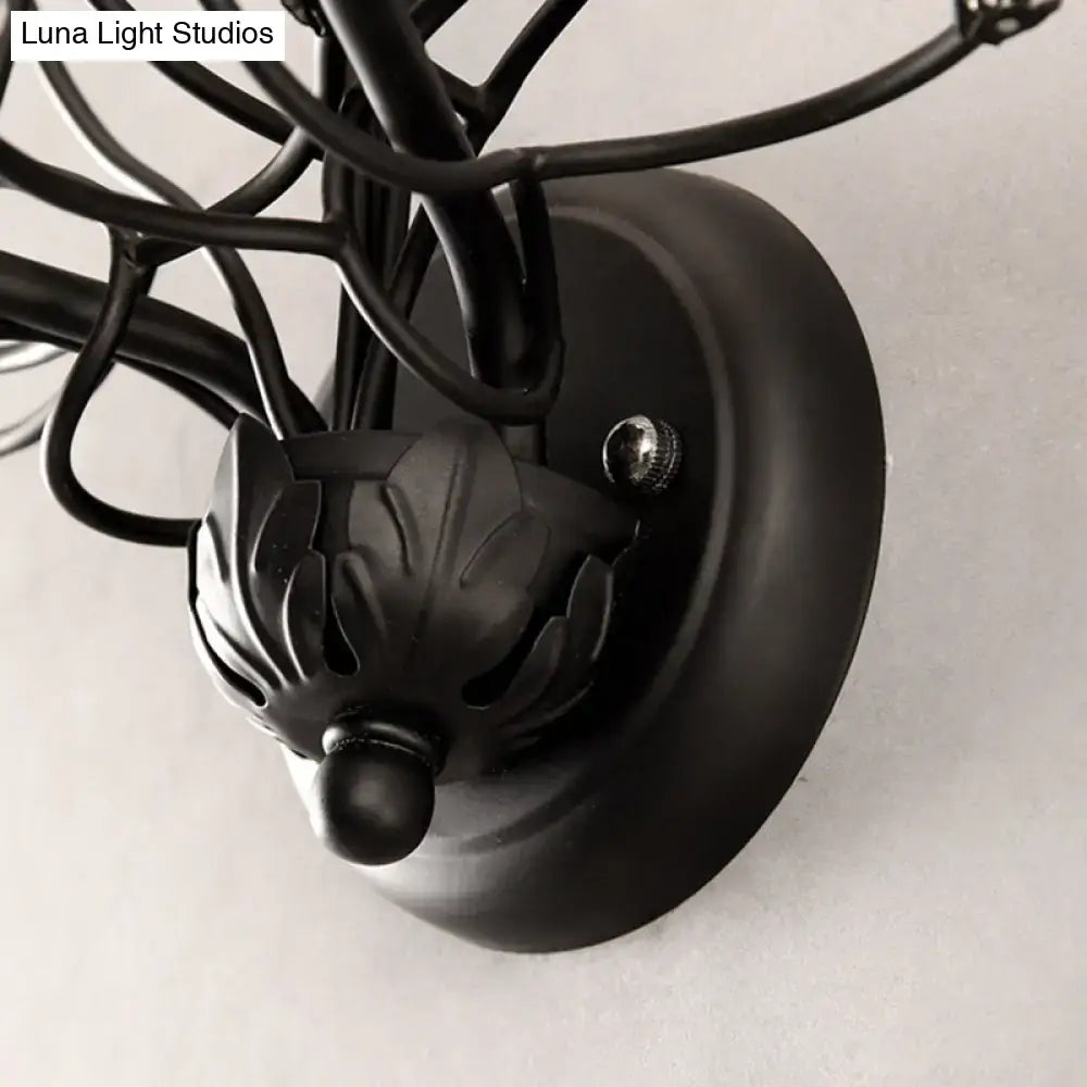 Black wrought iron wall light with leaf finial and crystal accents for e12 e14 bulbs in antique bronze finish