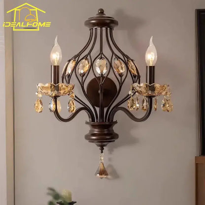 Antique bronze wrought iron wall lamp with amber and teardrop crystal candle accents for living room decorbites crystal candle