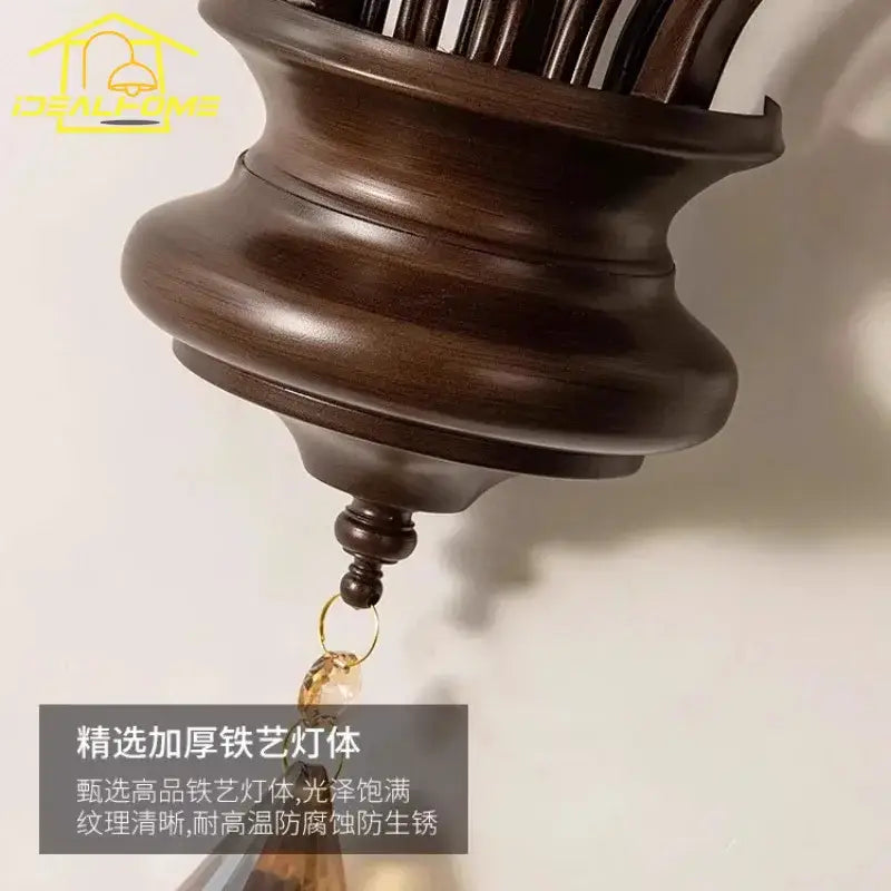 Dark brown wooden ceiling fan with glossy finish and carved details shown alongside antique bronze crystal candle wall lamp decorbites crystal candle