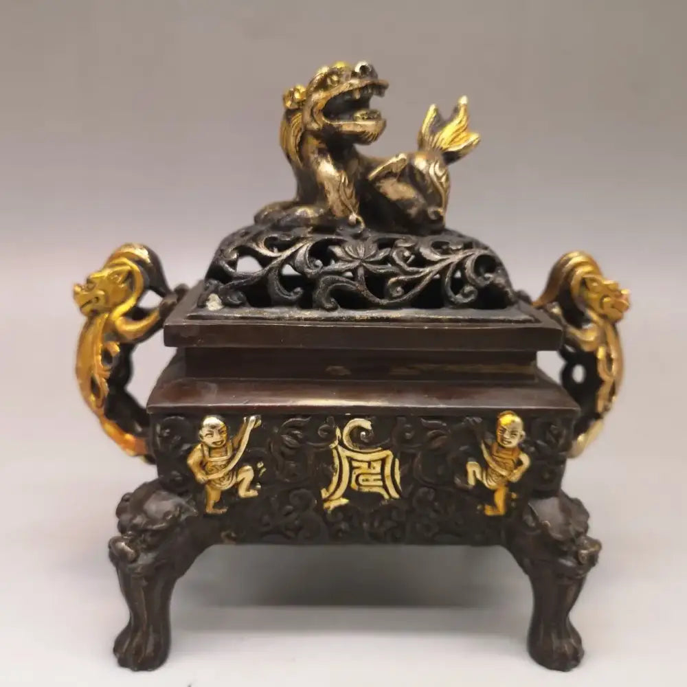 Antique dark bronze incense burner with gold double dragon lion and monkey embellishments, living room ornament