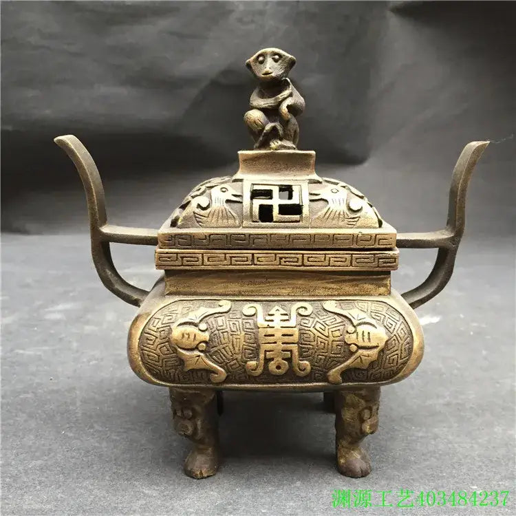 Antique bronze double dragon lion incense burner with intricate carvings and monkey figurine for living room decor
