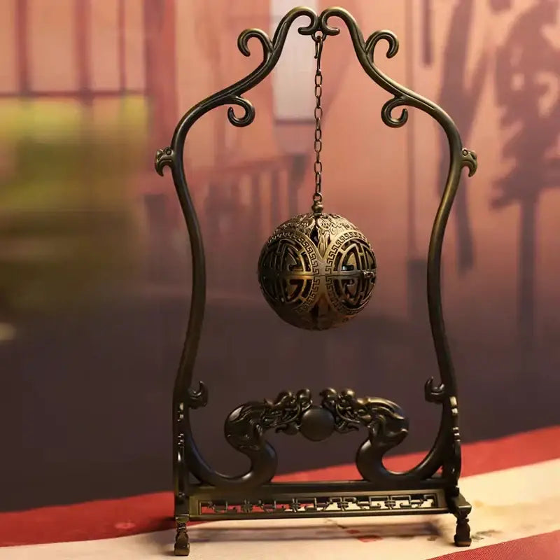Antique bronze dragon alloy incense burner with intricate geometric lattice hanging from wrought iron stand decorbites dragon alloy