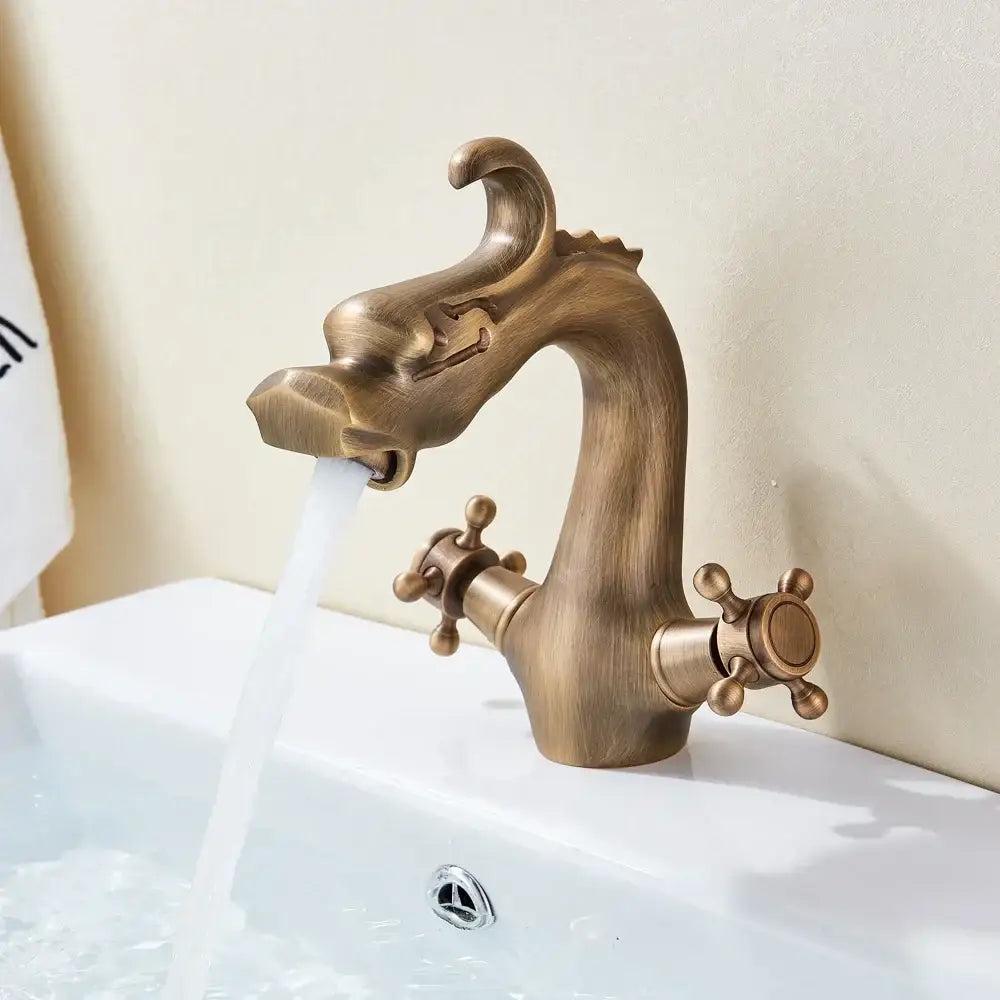 Antique bronze decorbites dragon handle basin faucet with detailed brass sculpted dragon head and two cross-handle controls