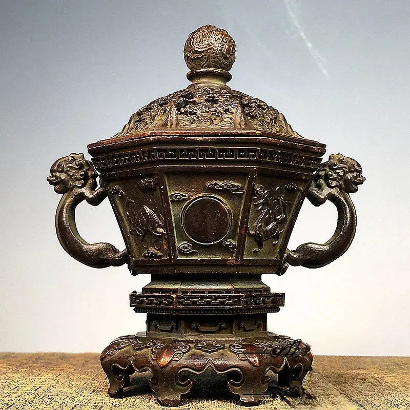 Antique bronze incense burner set featuring intricate dragon and cloud motifs with lion-head handles and domed lid
