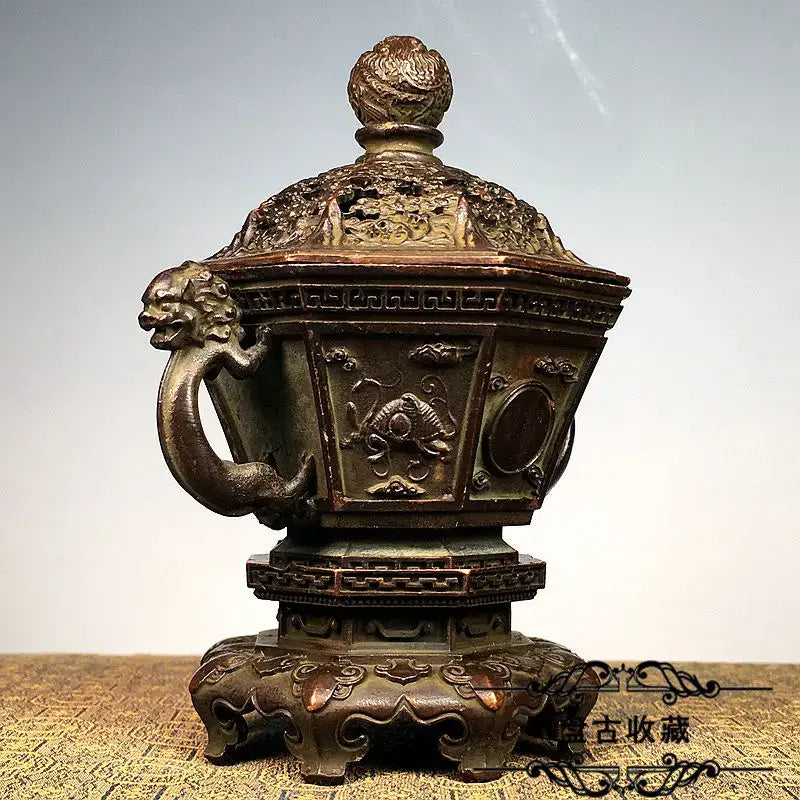 Antique bronze incense burner set with intricate dragon and fish carvings and lion-headed handle for living room decor