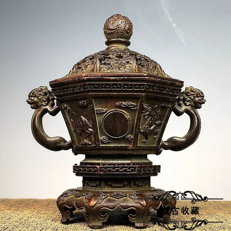 Antique bronze incense burner set with intricate dragon and cloud motifs, lion-head handles, and detailed domed lid for living room decor