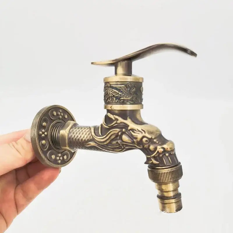 Antique bronze dragon tap bibcock outdoor garden faucet in brass with intricate dragon design and ornate detailing
