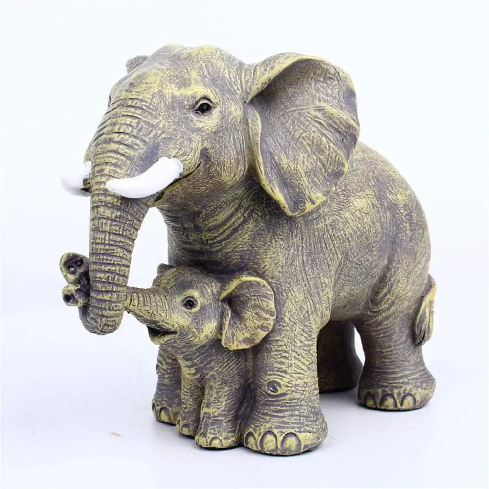 Antique bronze elephant family figurine with white tusks and detailed textured skin for living room decor