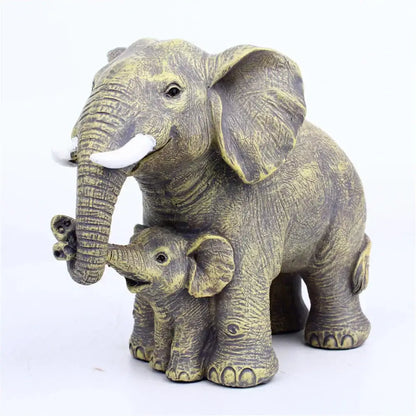 Antique bronze elephant family figurine with white tusks and detailed textured skin for living room decor