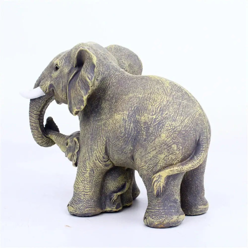 Antique bronze elephant family figurine in gray and greenish resin featuring a baby elephant under its trunk for living room decor