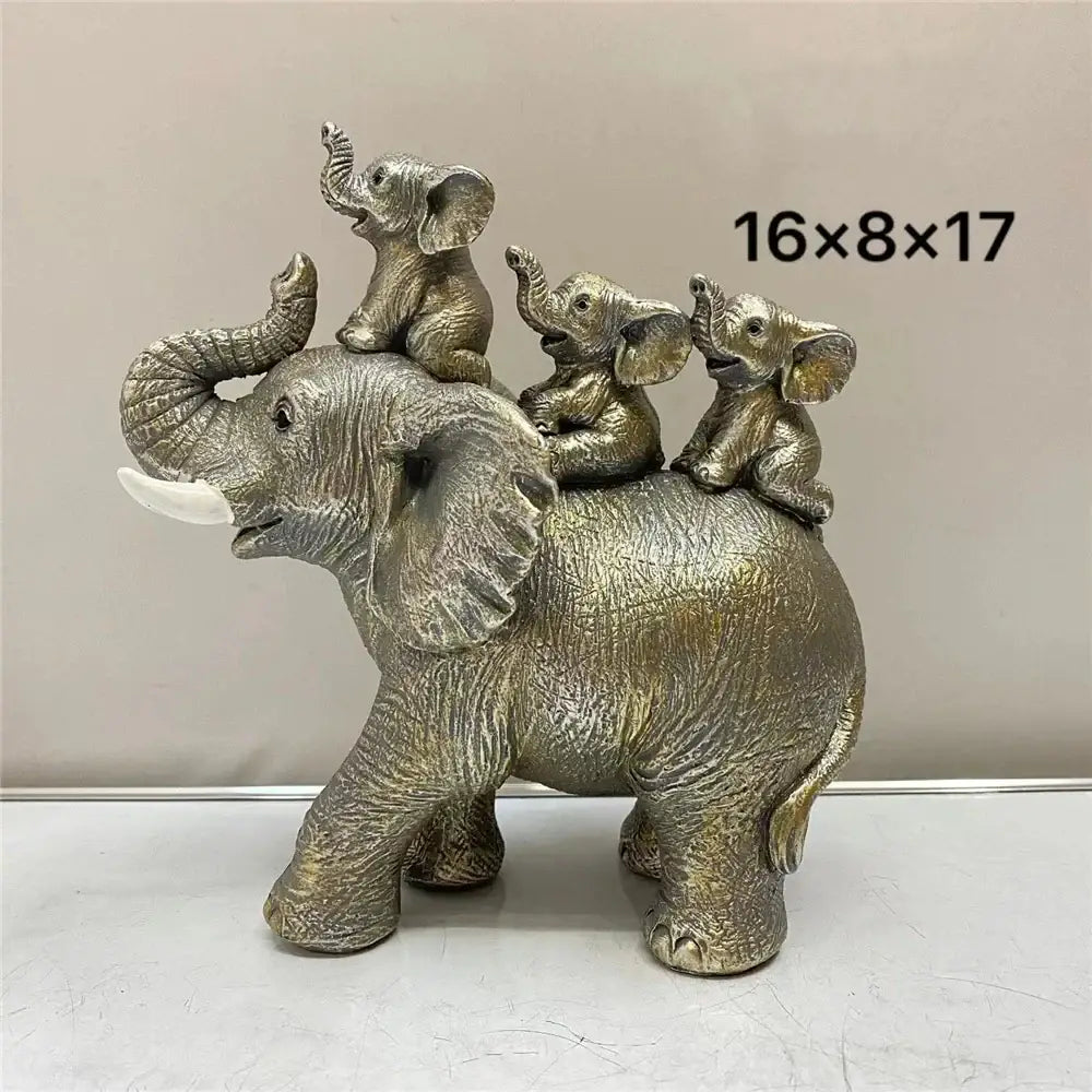 Silver-toned resin elephant family figurine with textured skin and white tusks for living room decoration