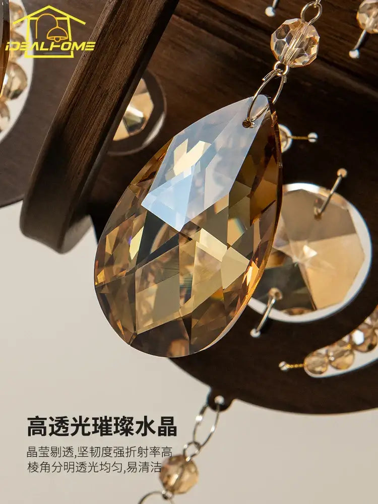 Antique bronze iron art crystal candle chandelier with teardrop-shaped amber art crystal pendant and gold-toned hook