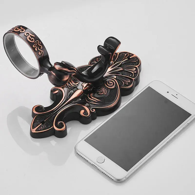 Antique bronze ornate ceramic toilet brush holder set with intricate floral and scrollwork design for bathroom use