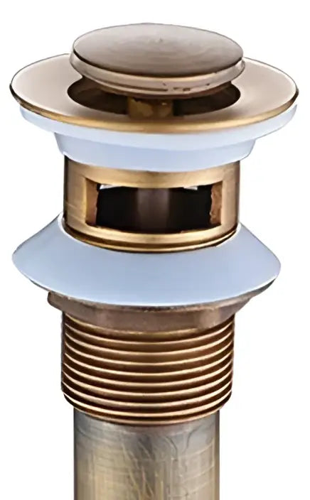 Antique brushed brass pop up sink drain with white ceramic flange and threaded metal pipe decorbites brass pop decor