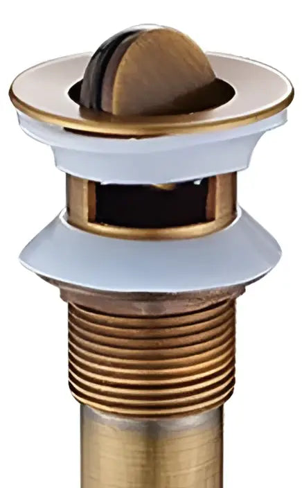 Antique brushed brass pop up sink drain stopper with gold-toned overflow drain and decorbites brass pop finish