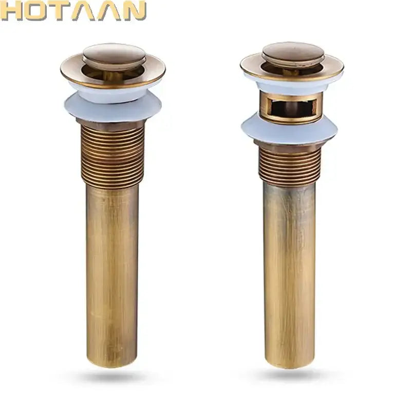 Antique brushed brass pop up sink drain stopper with white rubber seals and decorbites brass pop finish
