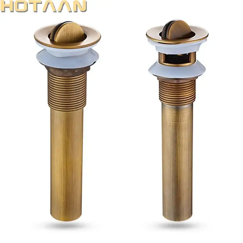 Antique brushed brass pop up sink drain bathroom stopper with white ceramic flange and rounded domed top decorbites brass pop