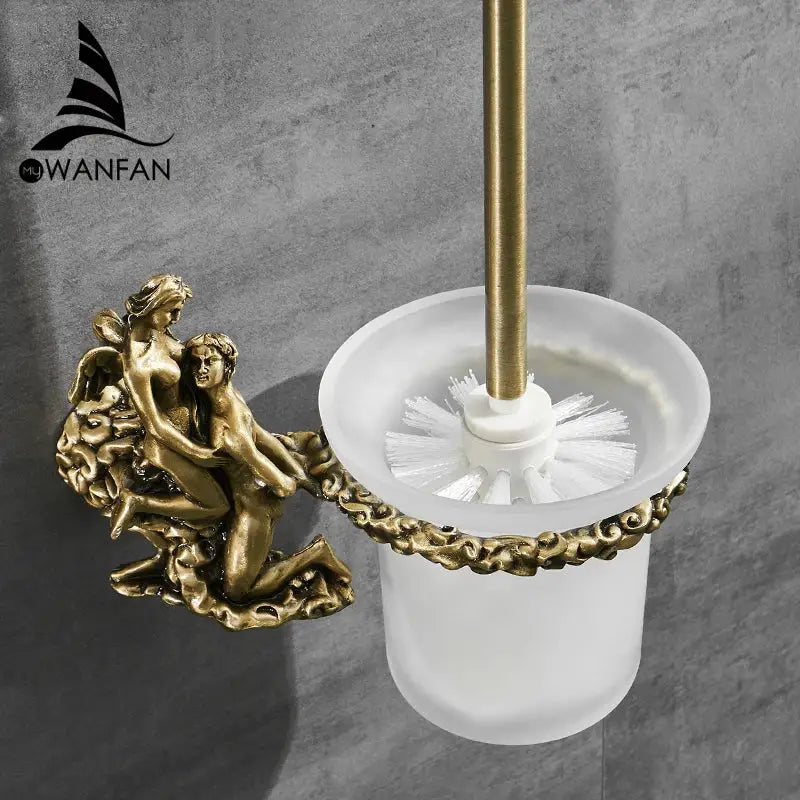 Antique cherub gold and silver toilet brush holder with gold-toned ornate design and frosted glass base for bathroom use