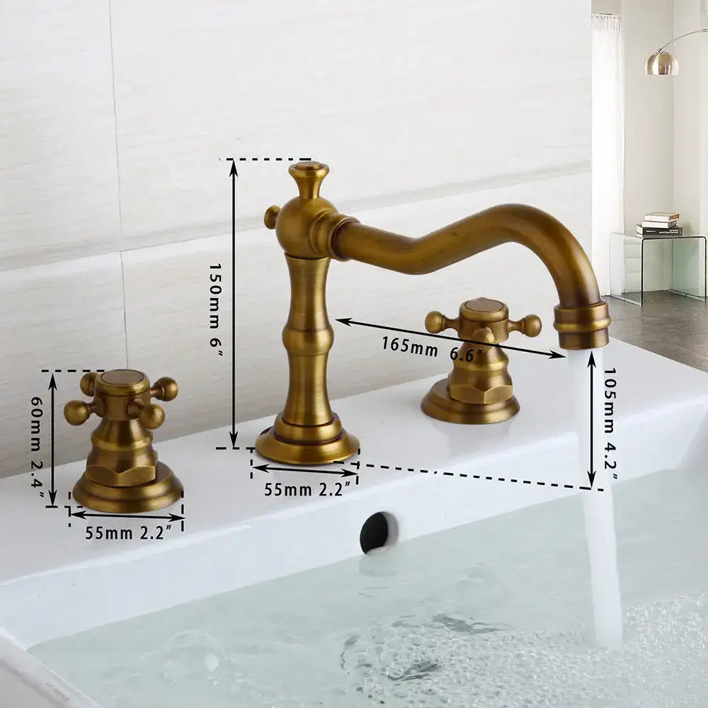 Antique brass finished decorbites dual handle basin faucet with ornate vintage design and curved spout for bathroom use