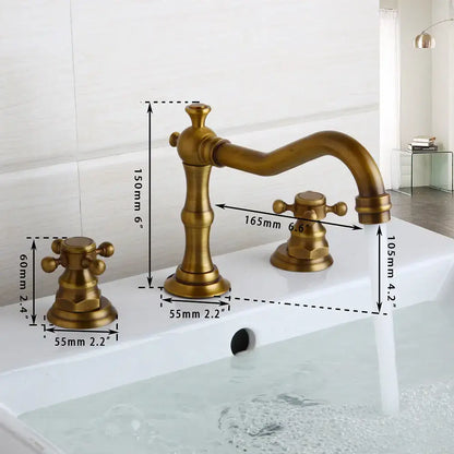 Antique brass finished decorbites dual handle basin faucet with ornate vintage design and curved spout for bathroom use
