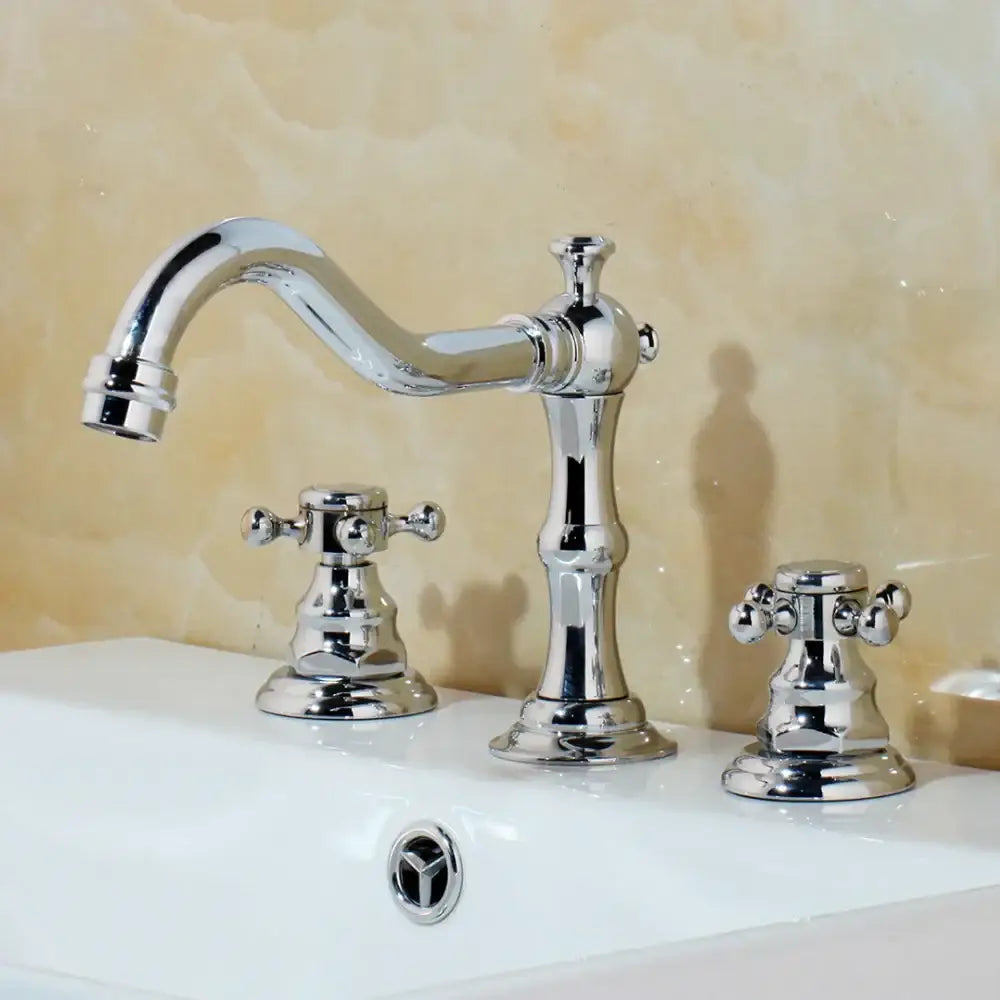 Chrome finished basin faucet with dual handle ornate cross handles and elegant curved spout by decorbites dual handle