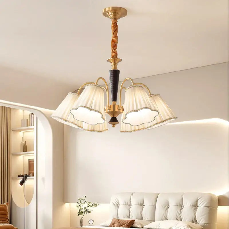 Antique copper chandelier with five cream scalloped fabric shades and twisted wooden stem for dining room lighting