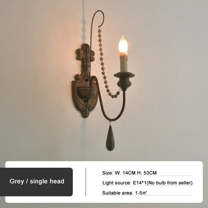 Antique country french wall lamp with grey wrought iron curved arm beaded chain and teardrop pendant decorbites country french wall