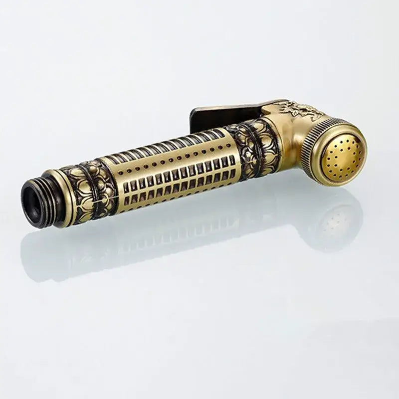 Antique engraved brass bidet shattaf with intricate floral embossing and adjustable bracket for bathroom hygienic washing