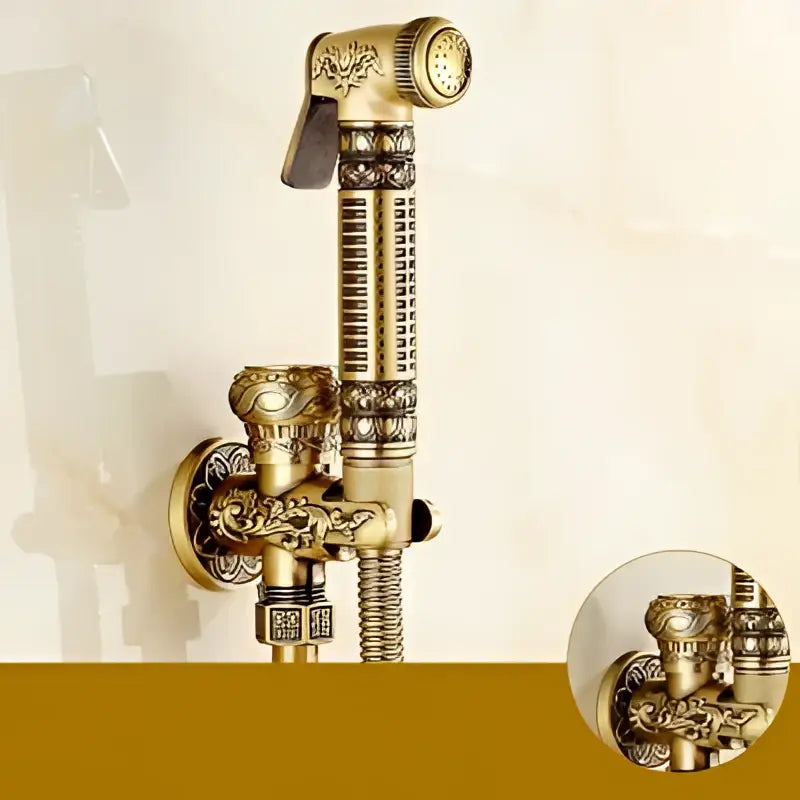 Antique engraved brass bidet shattaf with ornate floral and scrollwork detailing for hygienic bathroom washing